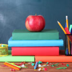 Composition,Of,Books,,Stationery,And,An,Apple,On,The,Teacher's
